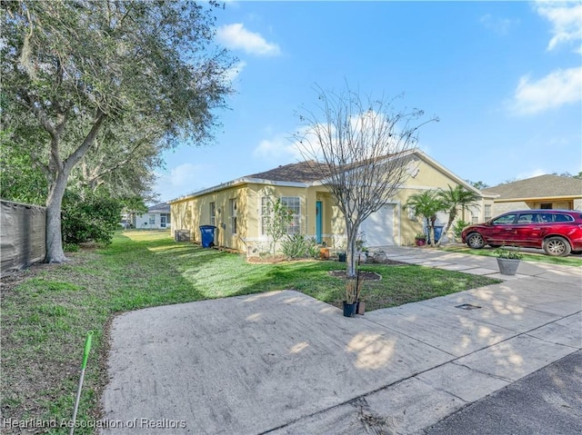 ranch-style house with concrete driveway, an attached garage, a front lawn, and stucco siding