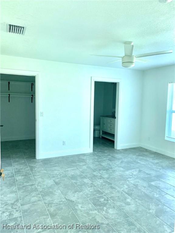 spare room featuring ceiling fan