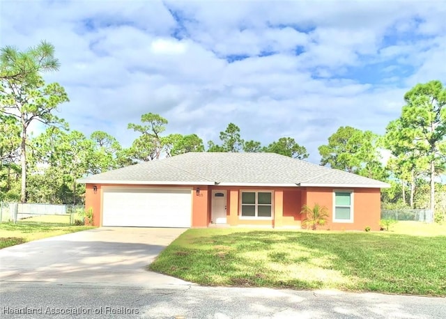 single story home featuring a front yard and a garage