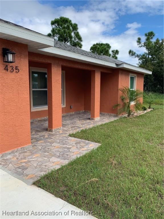 exterior space featuring a patio area and a yard