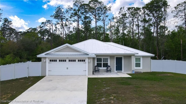 view of front facade with a garage and a front lawn