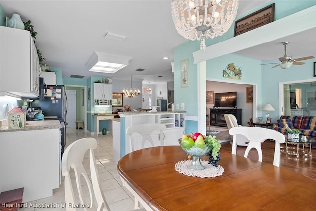 3243 E Anglers Strm, Avon Park, FL 33825 - dining space with a chandelier, light tile patterned flooring, a ceiling fan, and recessed lighting