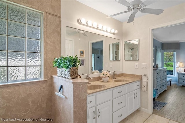 3243 E Anglers Strm, Avon Park, FL 33825 - bathroom featuring a ceiling fan, ensuite bathroom, double vanity, and tile patterned flooring