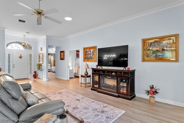 3243 E Anglers Strm, Avon Park, FL 33825 - living area with light wood-style floors, crown molding, and a ceiling fan