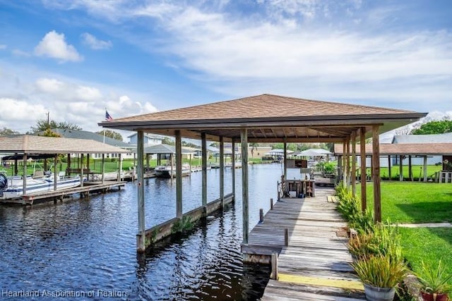 dock area featuring a water view and boat lift