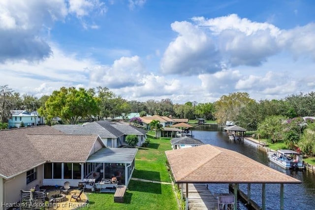 birds eye view of property with a water view