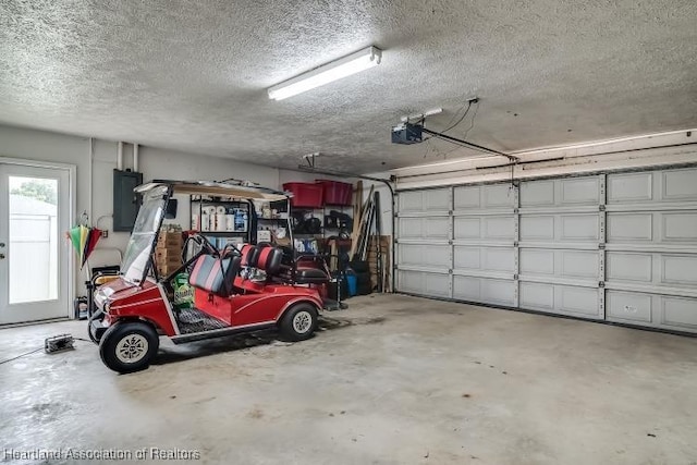 garage featuring a garage door opener and electric panel