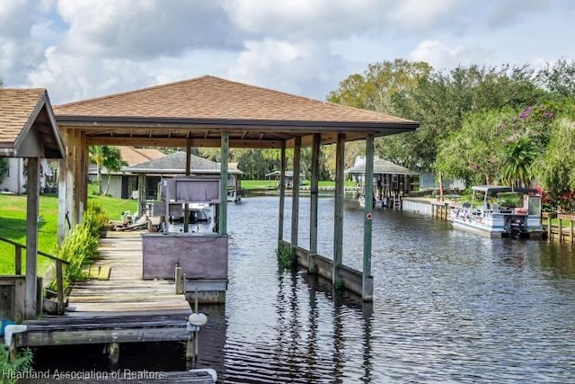 view of dock with a water view and boat lift