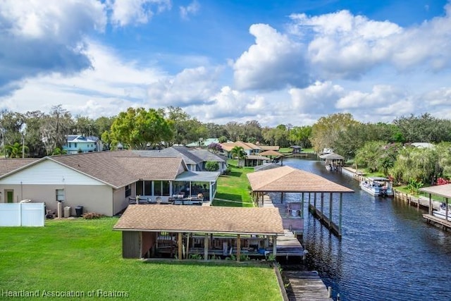 exterior space with a water view and a yard