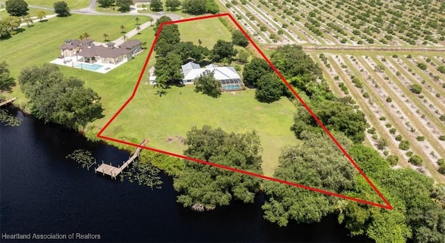 birds eye view of property with a water view and a rural view