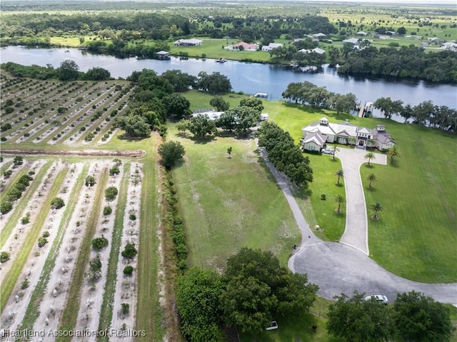 birds eye view of property featuring a rural view and a water view