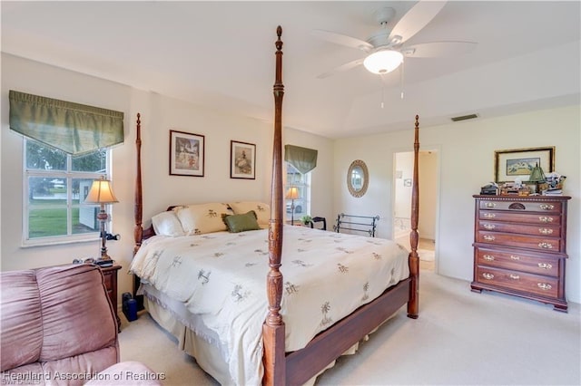 bedroom with ceiling fan and light carpet