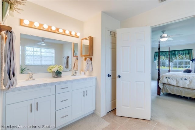 bathroom with tile patterned floors, ceiling fan, and vanity