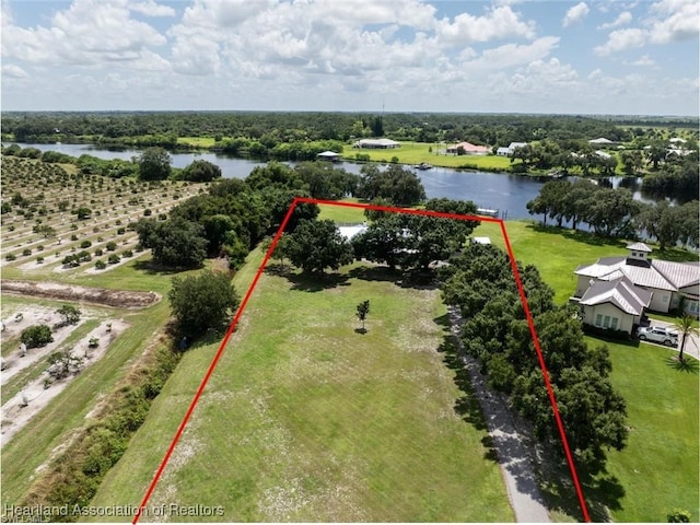 birds eye view of property with a water view