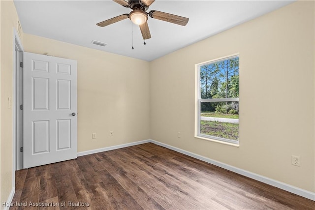 1100 Redbird St, Lake Placid, FL 33852 - unfurnished room featuring wood finished floors, baseboards, and a ceiling fan