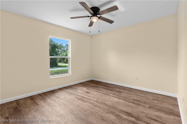 1100 Redbird St, Lake Placid, FL 33852 - unfurnished room featuring wood finished floors, baseboards, and ceiling fan