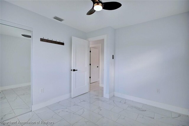 unfurnished room featuring ceiling fan