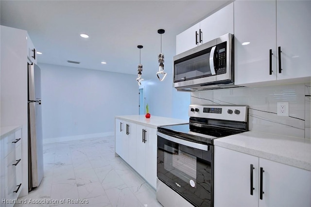 kitchen featuring appliances with stainless steel finishes, backsplash, white cabinetry, and pendant lighting