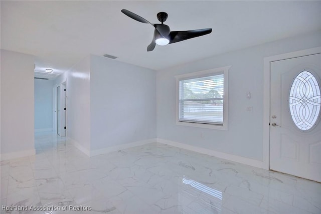 entrance foyer with ceiling fan