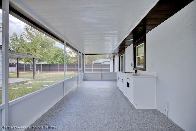 unfurnished sunroom featuring sink