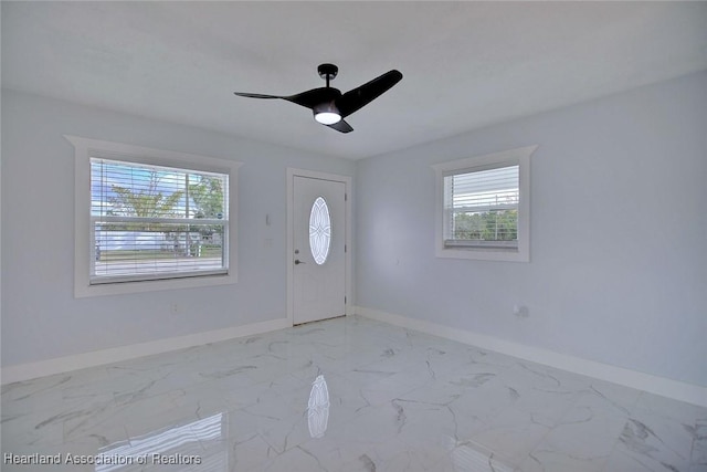 entryway featuring ceiling fan