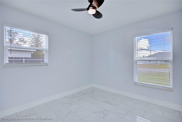 unfurnished room with ceiling fan