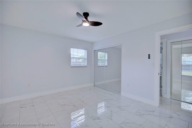 unfurnished bedroom featuring ceiling fan