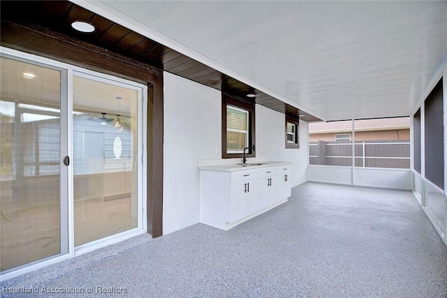 unfurnished sunroom with sink