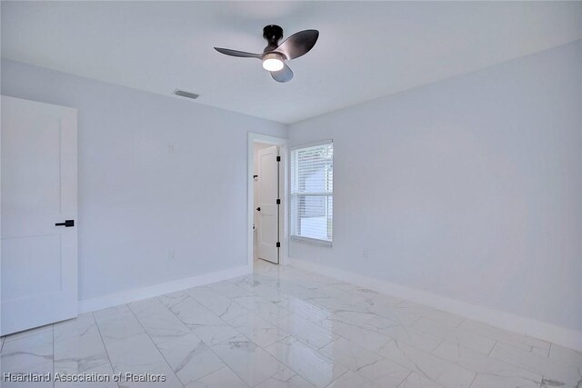 empty room featuring ceiling fan