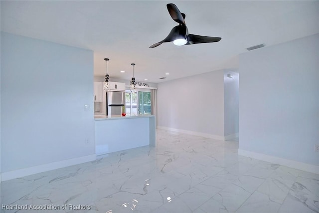 unfurnished living room with ceiling fan