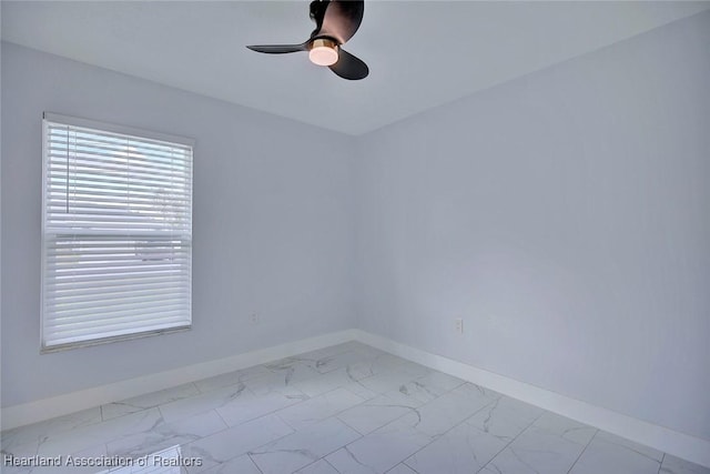 unfurnished room with ceiling fan