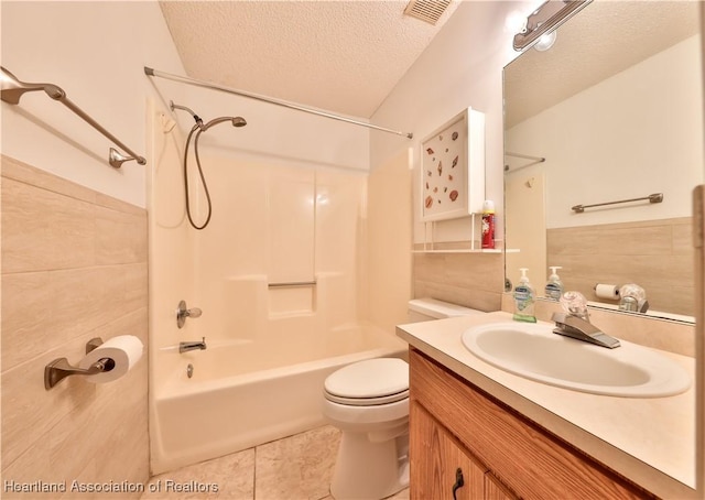232 Dove Ave, Sebring, FL 33870 - full bath with vanity, a textured ceiling, toilet, shower / bath combination, and tile patterned flooring