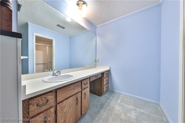 232 Dove Ave, Sebring, FL 33870 - bathroom featuring a textured ceiling, vanity, and baseboards