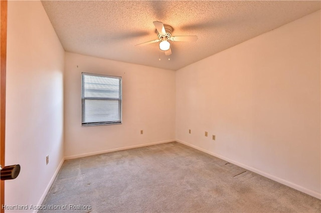 232 Dove Ave, Sebring, FL 33870 - spare room featuring carpet, a ceiling fan, a textured ceiling, and baseboards