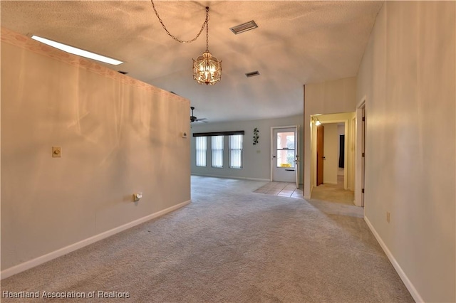 232 Dove Ave, Sebring, FL 33870 - carpeted spare room featuring a chandelier, baseboards, and a textured ceiling