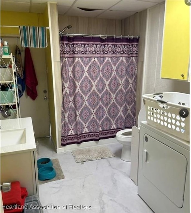 bathroom featuring a shower with curtain, a paneled ceiling, vanity, and toilet