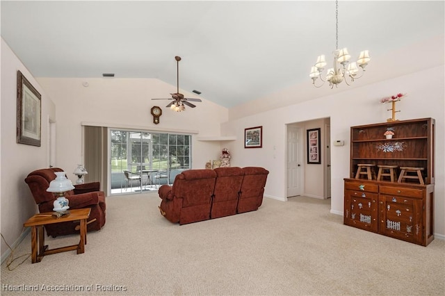 carpeted living room with ceiling fan with notable chandelier and vaulted ceiling