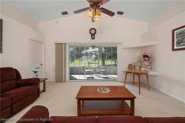 carpeted living room featuring ceiling fan and vaulted ceiling