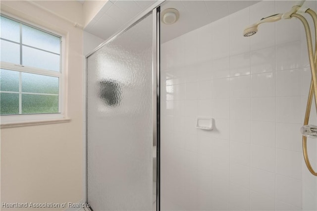 bathroom with an enclosed shower