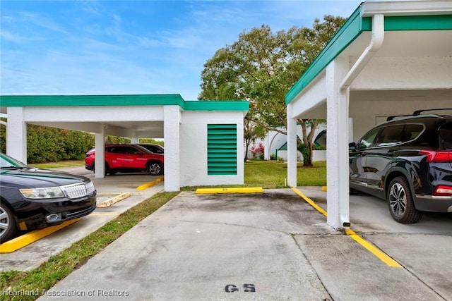 view of parking / parking lot featuring a carport