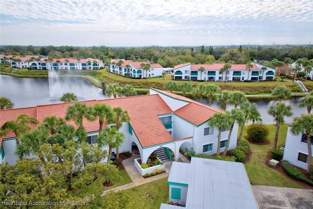 drone / aerial view with a water view