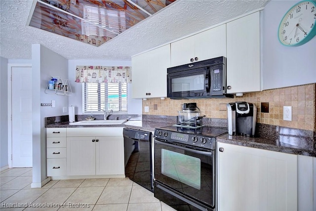 kitchen with light tile patterned flooring, sink, white cabinetry, a textured ceiling, and black appliances