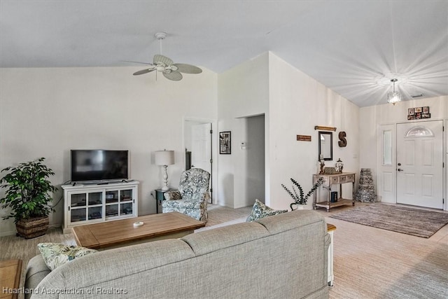 living room featuring lofted ceiling and ceiling fan