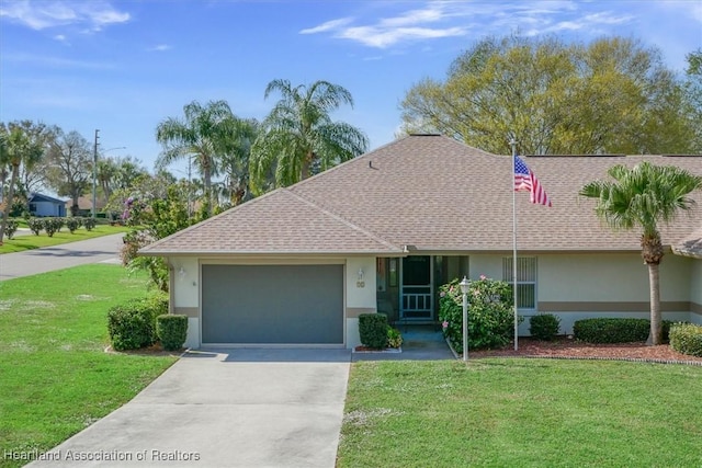 ranch-style house with a garage and a front lawn