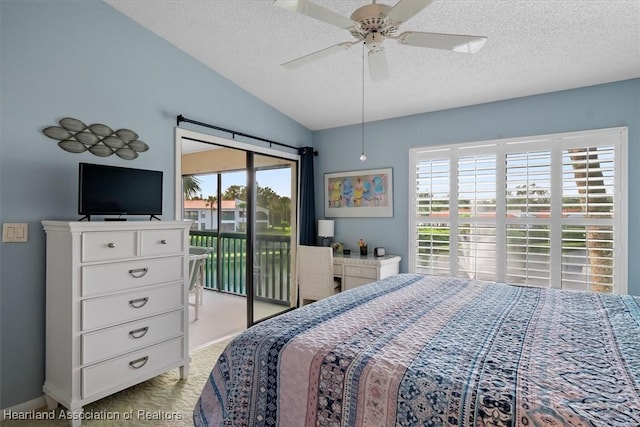 bedroom with access to outside, multiple windows, ceiling fan, and lofted ceiling