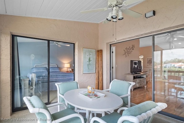 sunroom / solarium featuring wood ceiling