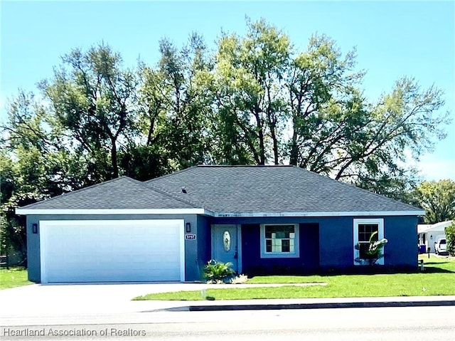 single story home featuring a front yard, roof with shingles, stucco siding, a garage, and driveway