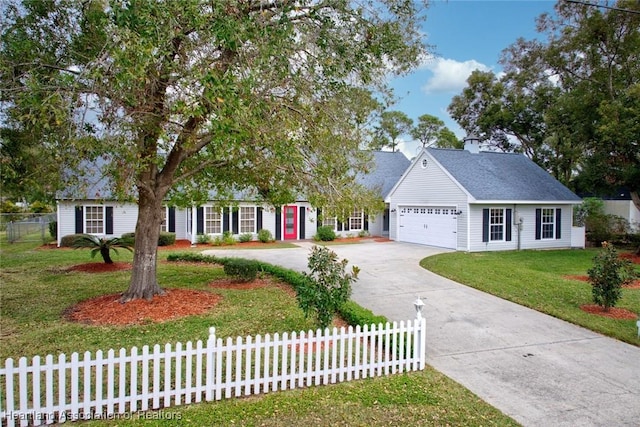 view of front of house with a front lawn and a garage