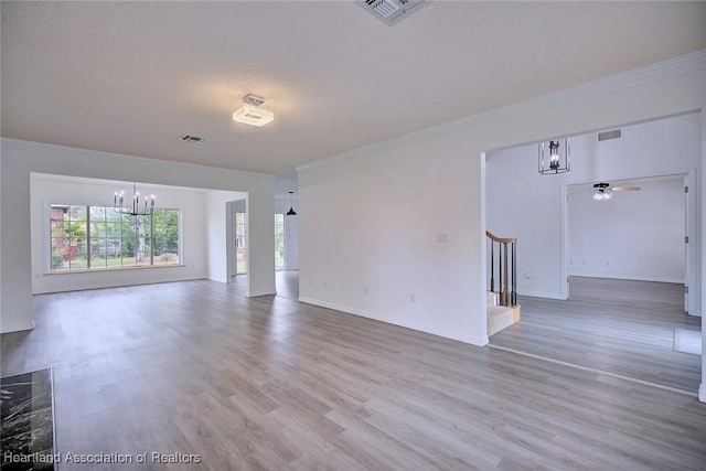 unfurnished room featuring hardwood / wood-style floors, ceiling fan with notable chandelier, crown molding, and a textured ceiling