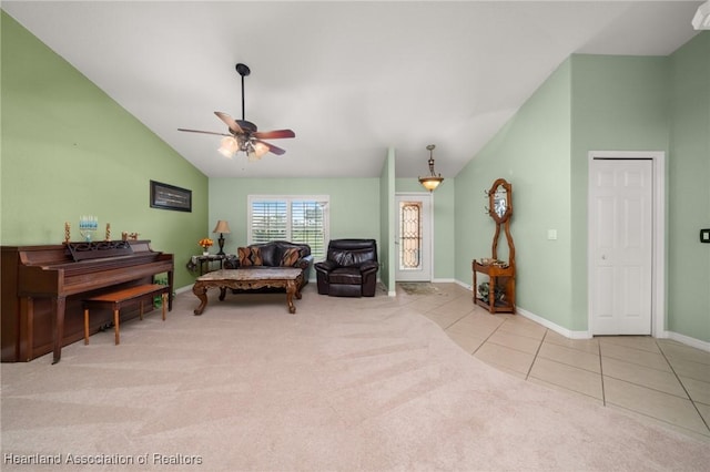 4023 Santa Barbara Dr, Sebring, FL 33875 - living area featuring a ceiling fan, tile patterned flooring, carpet floors, baseboards, and high vaulted ceiling